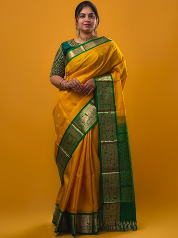 Pethambari pattu saree golden yellow color allover zari motifs & kanchi border with rich pallu and attached plain blouse