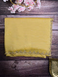 Chiffon crush fancy saree light yellow color allover stone work & embroidery border with running pallu and attached self blouse