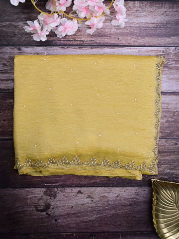 Chiffon crush fancy saree light yellow color allover stone work & embroidery border with running pallu and attached self blouse