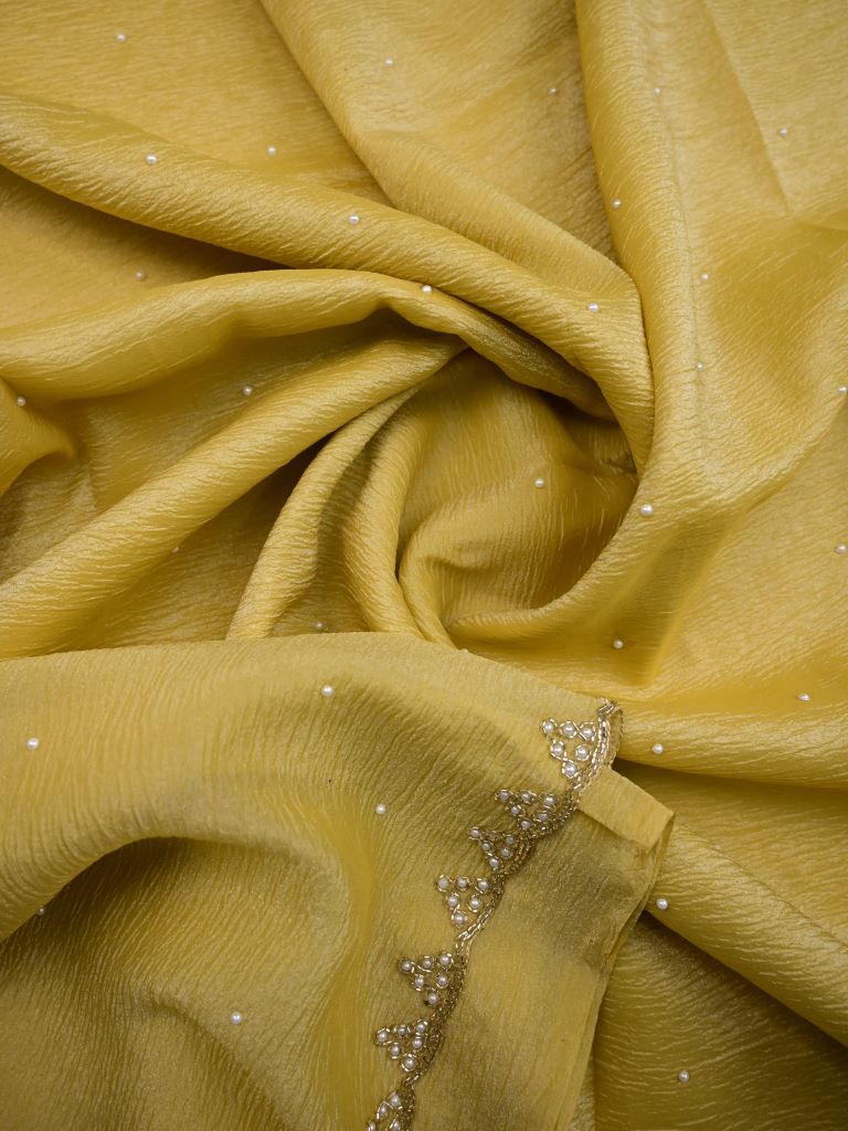 Chiffon crush fancy saree light yellow color allover stone work & embroidery border with running pallu and attached self blouse