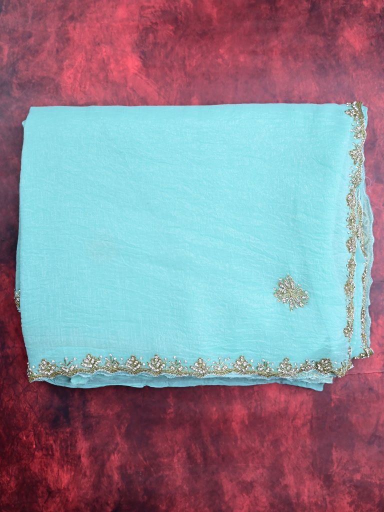 Organza shimmer sky blue color allover embroidery butis & embroidery border with running pallu and attached blouse