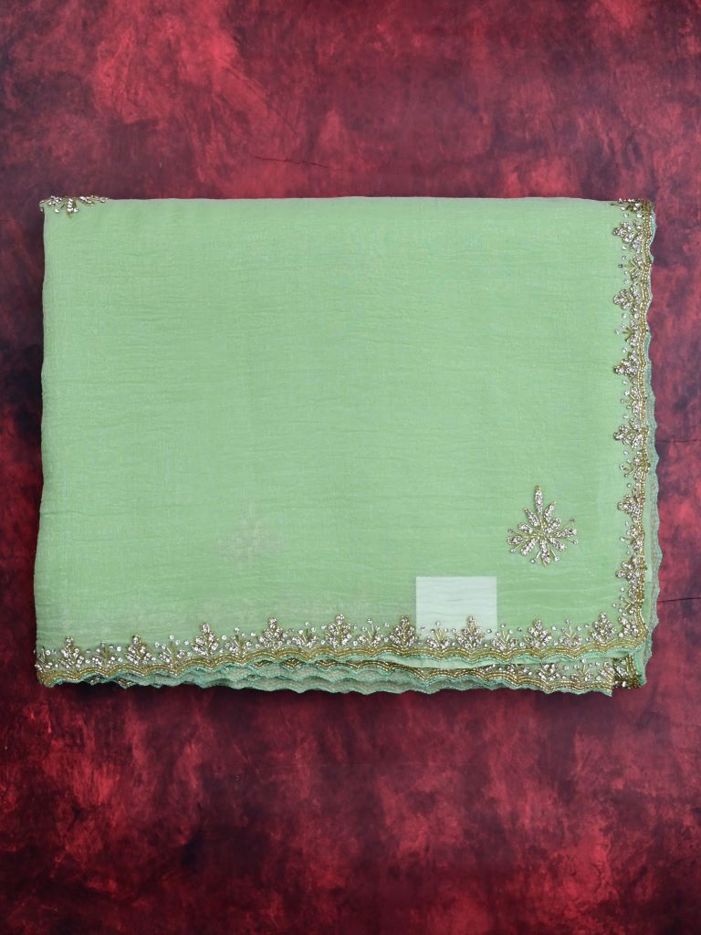 Organza shimmer pista green color allover embroidery butis & embroidery border with running pallu and attached blouse