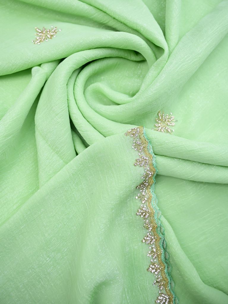 Organza shimmer pista green color allover embroidery butis & embroidery border with running pallu and attached blouse