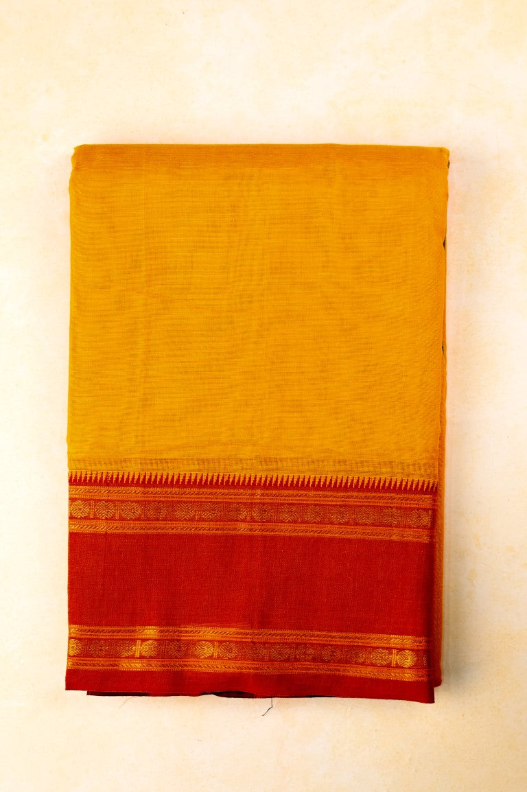 Narayanpet cotton saree yellow color with contrast zari gap border, short pallu and plain blouse.