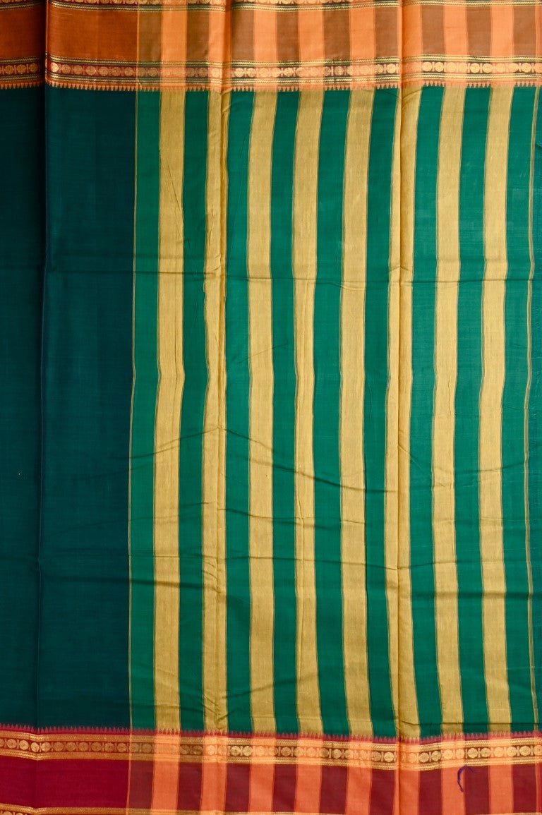 Narayanpet cotton saree bottle green color with contrast zari gap border, short pallu and plain blouse.