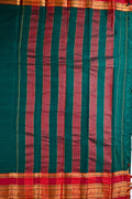 Narayanpet cotton saree bottle green color with contrast big zari border, short pallu and plain blouse.