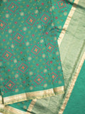 Munga pattu saree bottle green color allover weaves & small zari border with short pallu and attached plain blouse