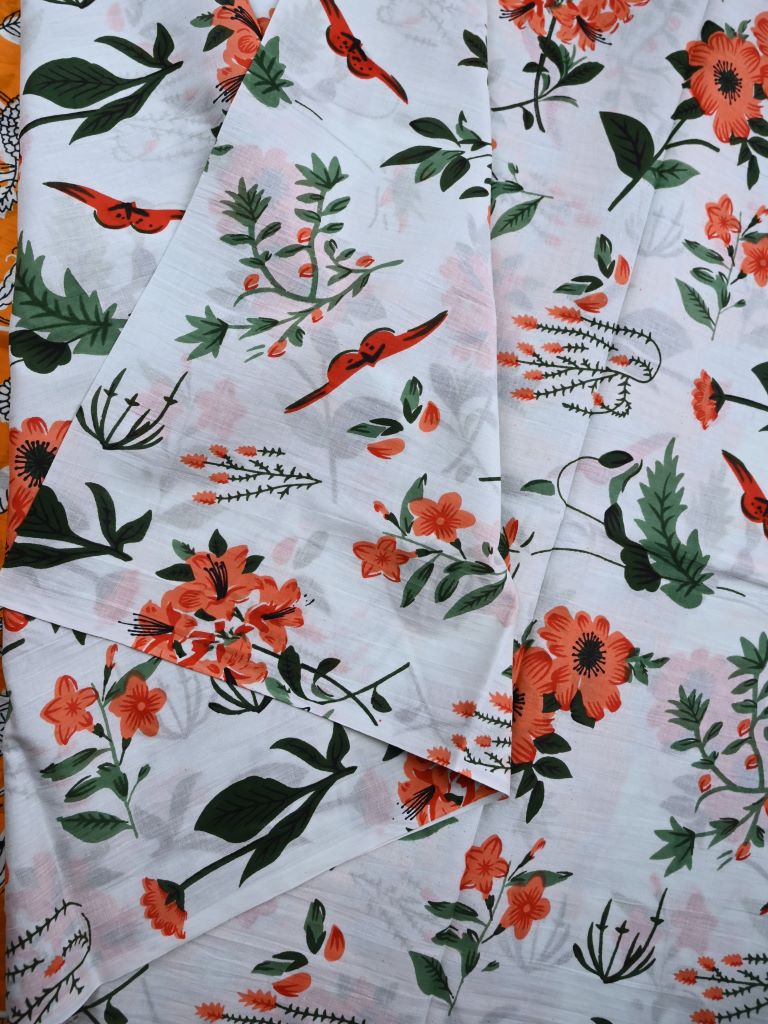 Cotton printed saree white color allover prints & printed border with printed pallu and contrast printed blouse