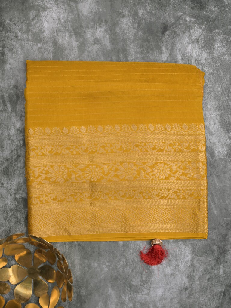 Dola silk fancy saree golden yellow color allover stripes & zari border with short pallu and attached contrast blouse