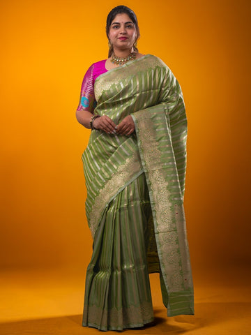 Banaras fancy saree pista green color allover zari weaves & zari border with rich pallu and plain blouse