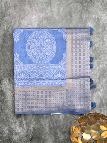 Dupion fancy saree sky blue color allover prints & zari border with rich pallu and attached plain blouse