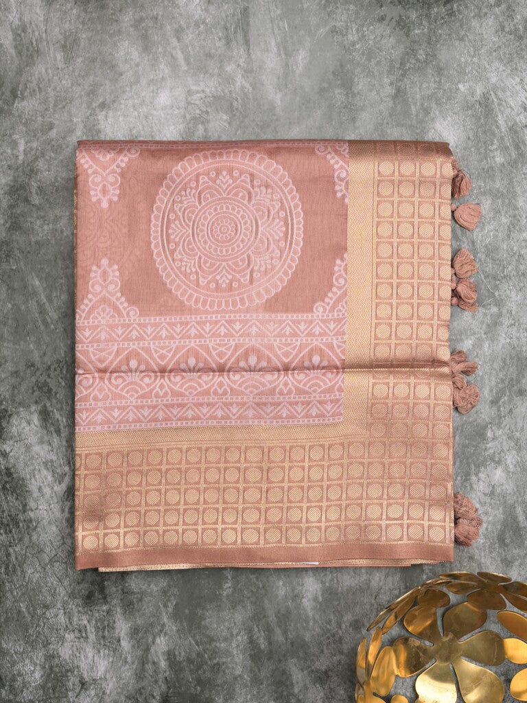 Dupion fancy saree peach color allover prints & zari border with rich pallu and attached plain blouse