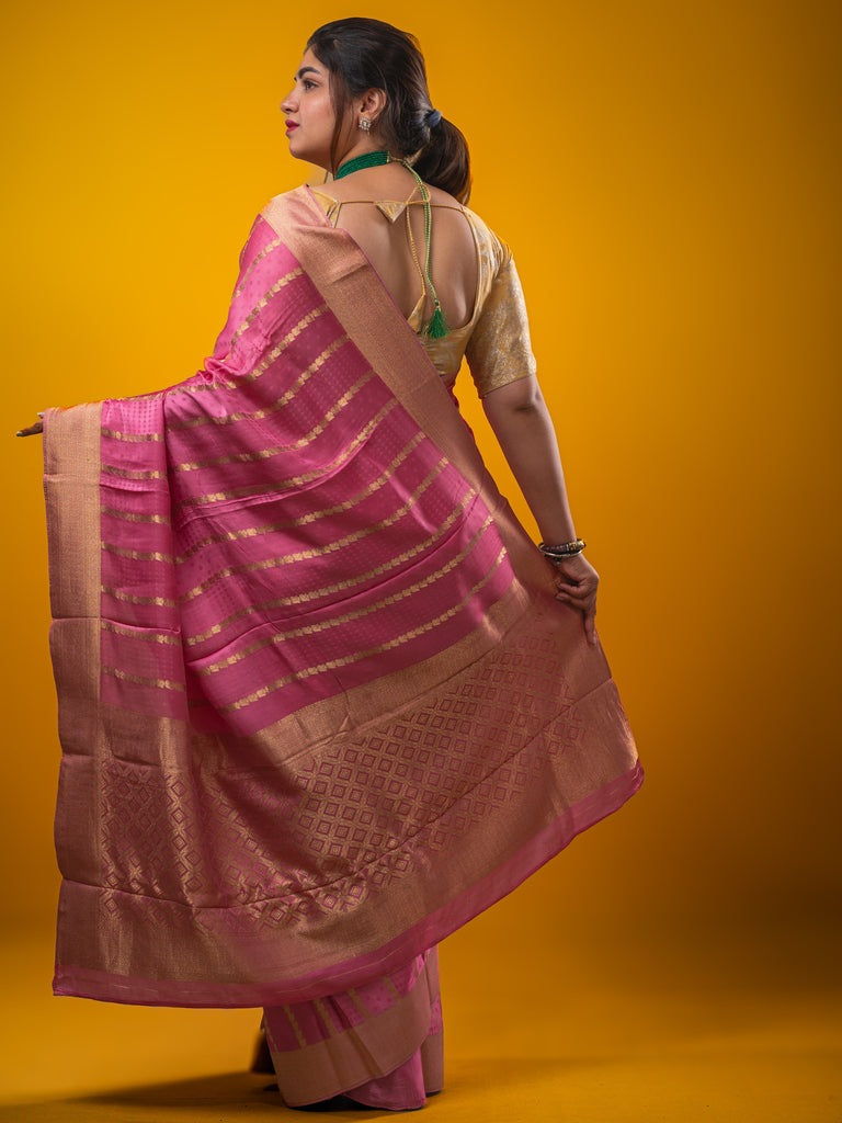 Crape fancy saree baby pink color allover zari weaves & zari border with zari pallu and plain blouse