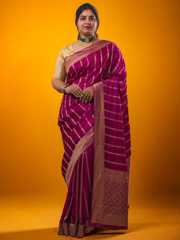 Crape fancy saree magenta color allover zari weaves & zari border with zari pallu and plain blouse