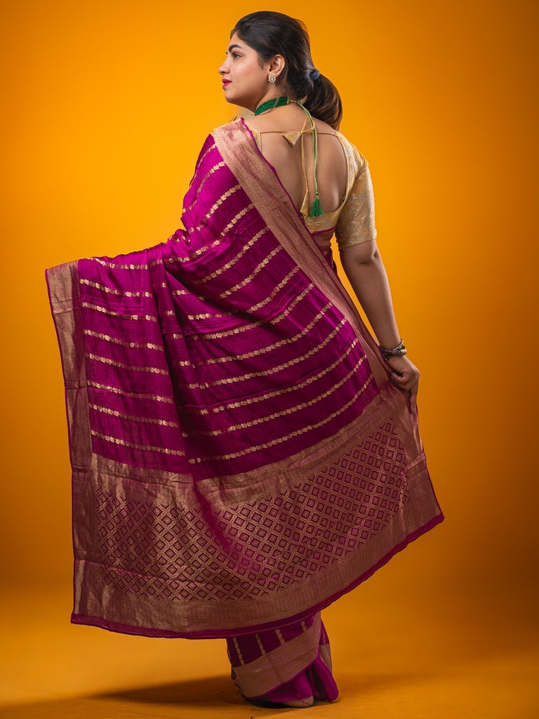 Crape fancy saree magenta color allover zari weaves & zari border with zari pallu and plain blouse