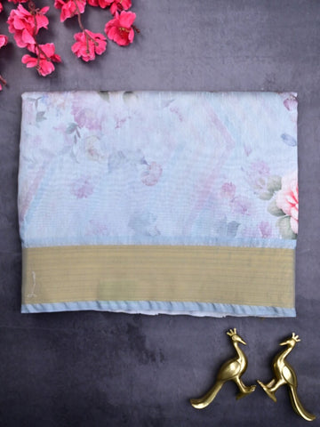 Jute fancy saree sea blue color allover prints & kaddi border with contrast pallu and printed blouse