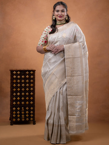 Dola tissue fancy saree white color allover zari motifs & zari border with rich pallu and plain self blouse