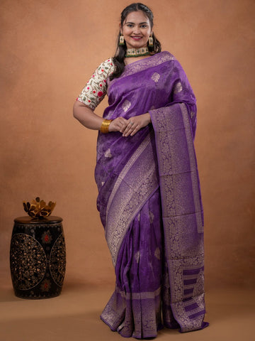 Dola tissue fancy saree purple color allover zari motifs & zari border with rich pallu and plain self blouse