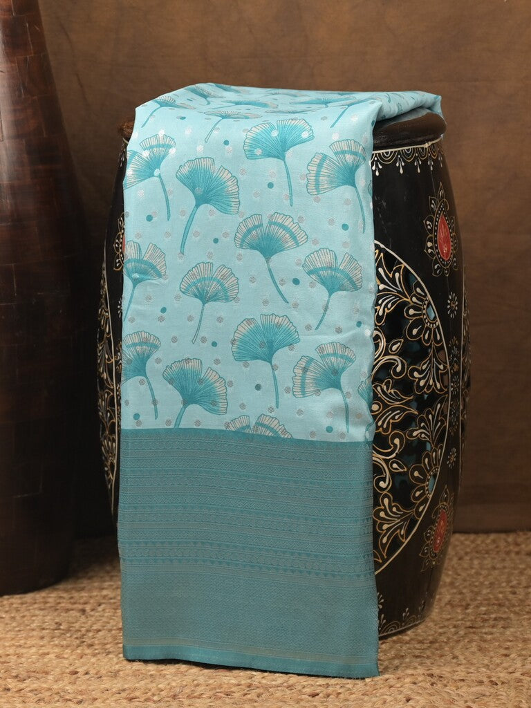 Crape fancy saree light blue color allover prints, zari motifs & zari border with rich pallu and attached blouse