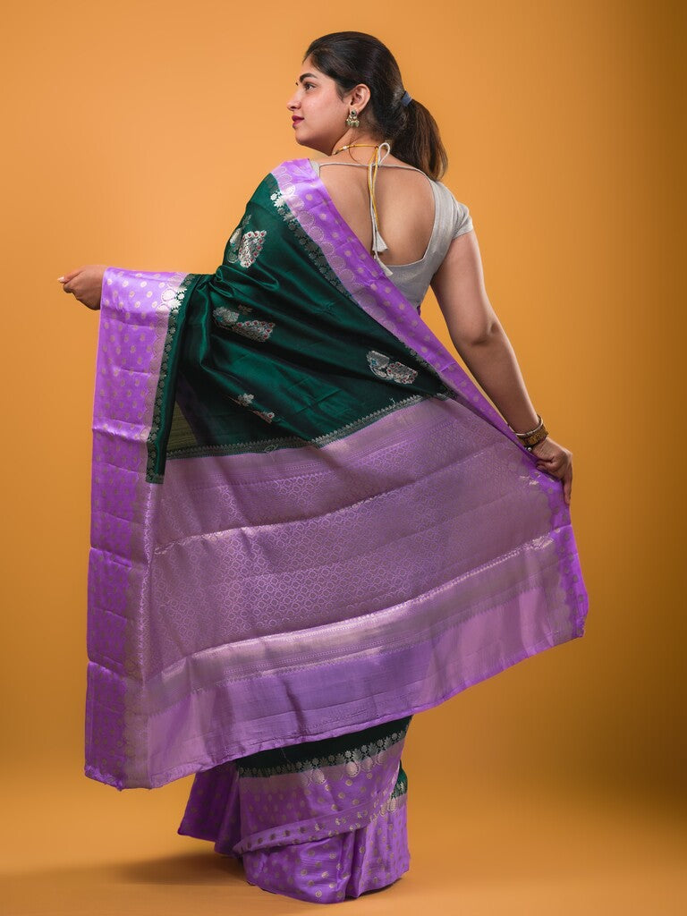 Chiniya pattu saree dark green color allover zari weaves & zari border with brocade pallu and attached contrast blouse