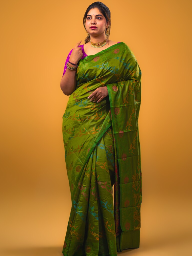 Fancy pattu saree olive green color allover weaves & small border with self pallu and attached blouse