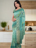 Maheswari fancy saree leaf green color allover digital prints & zari border with striped pallu and printed blouse