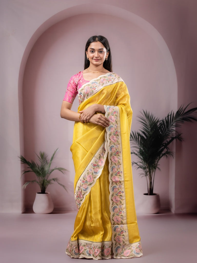 Dola tissue fancy saree yellow color allover stripes & designer fancy border with running pallu and embroidery blouse