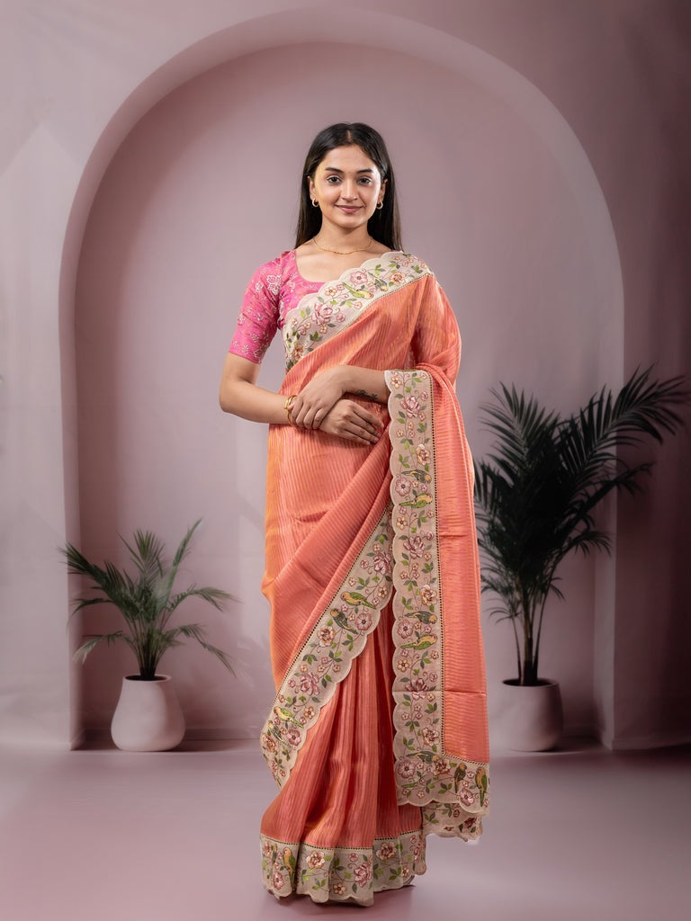 Dola tissue fancy saree peach color allover stripes & embroidery cutwork border with running pallu and plain blouse