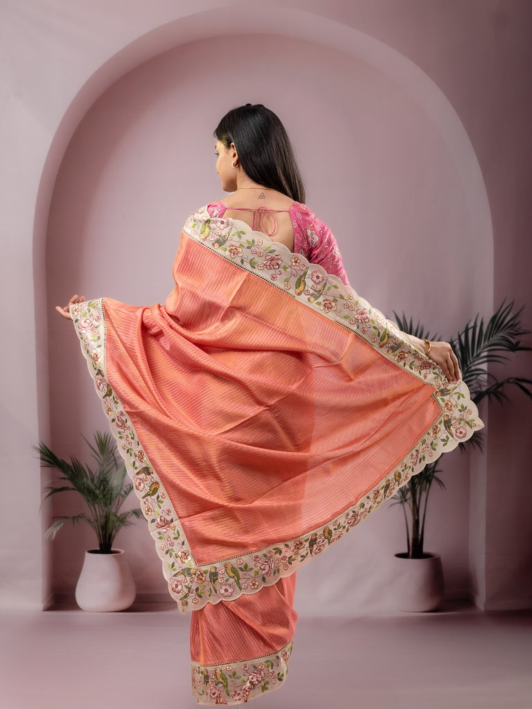 Dola tissue fancy saree peach color allover stripes & embroidery cutwork border with running pallu and plain blouse