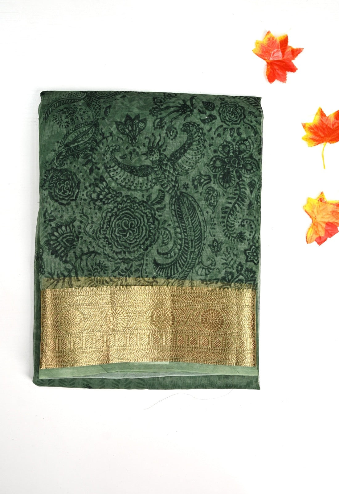 Organza Saree green color with allover prints, small gold zari border, short pallu and plain blouse