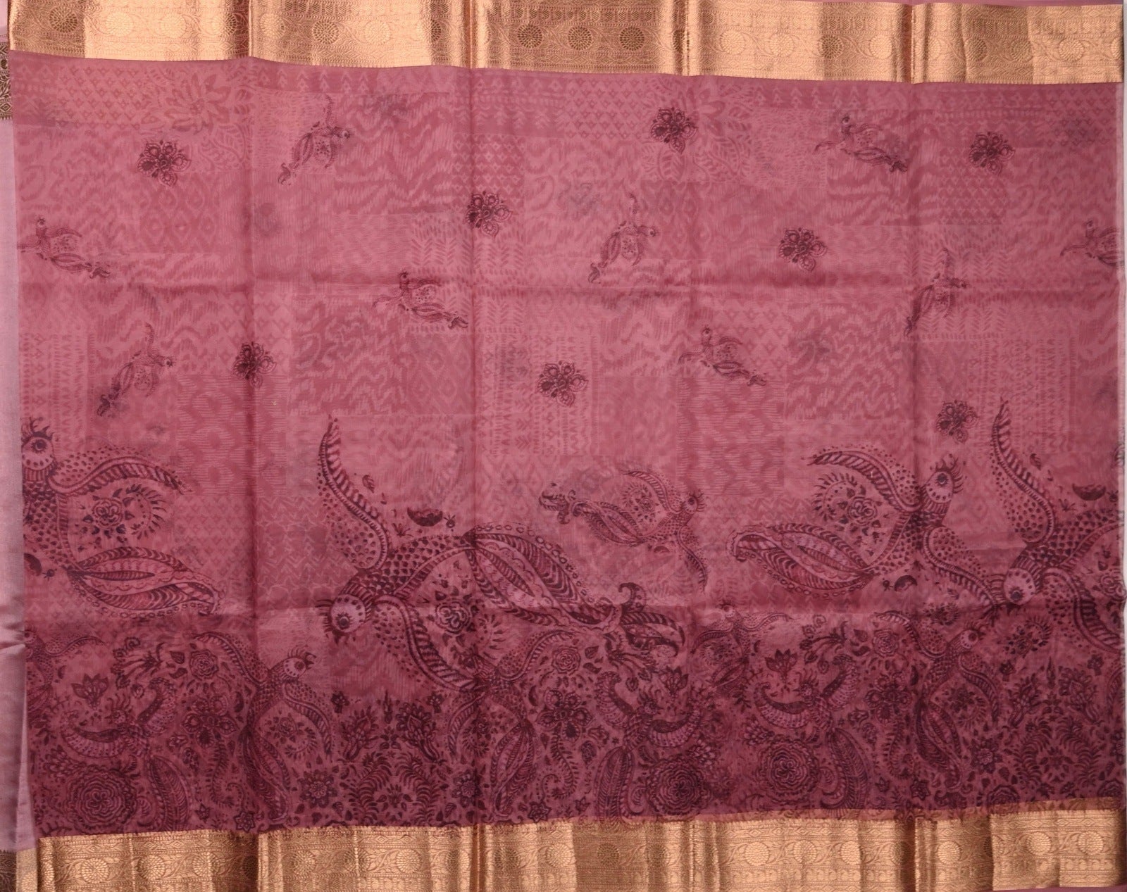 Organza Saree pink color with allover prints, small gold zari border, short pallu and plain blouse