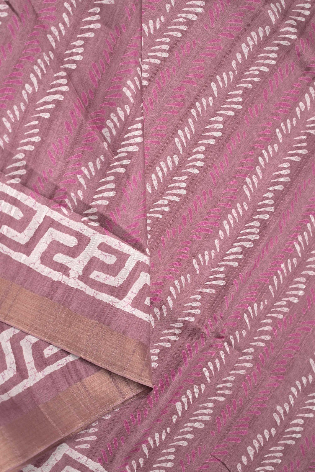 Jute tussar fancy baby pink color allover prints & small printed kaddi border with attached printed blouse