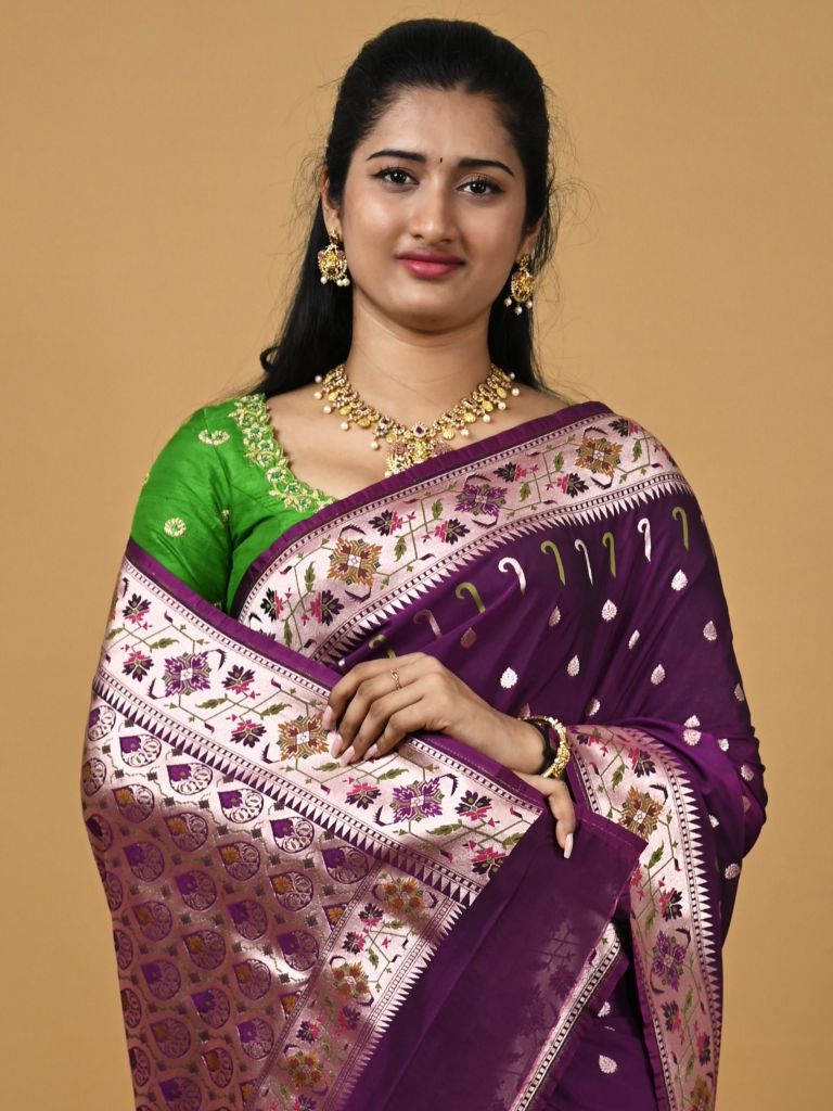 Banaras pattu fancy saree in violet color allover zari motifs and paithani border paired with plain blouse