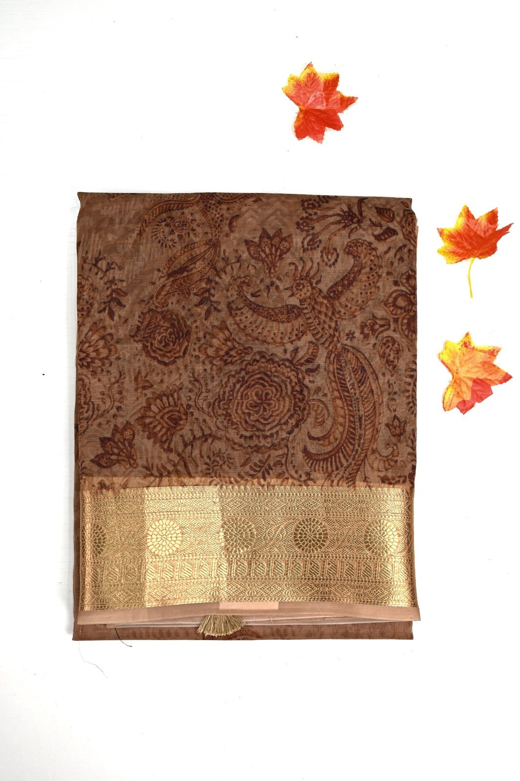 Organza Saree brown color with allover prints, small gold zari border, short pallu and plain blouse