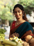 Dhaka cotton saree in peacock blue color with contrast pallu and attached blouse