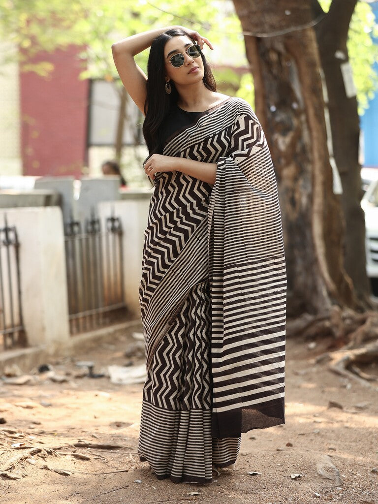 Maheswari fancy saree in black and white color with printed pallu and attached blouse