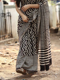 Maheswari fancy saree in black and white color with printed pallu and attached blouse