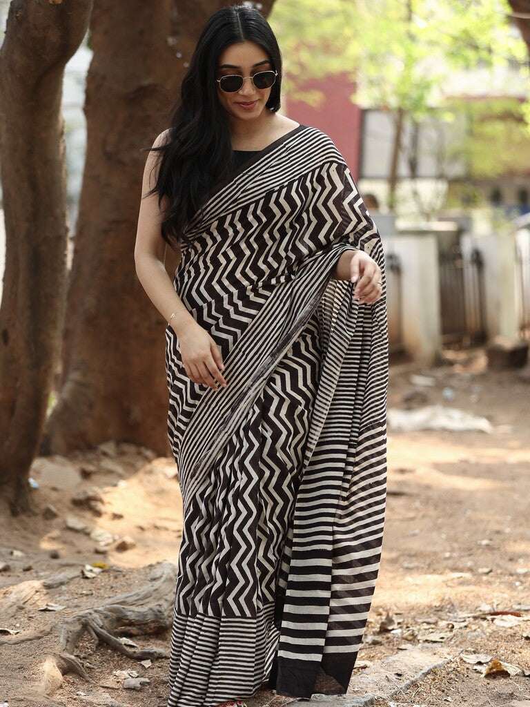 Maheswari fancy saree in black and white color with printed pallu and attached blouse