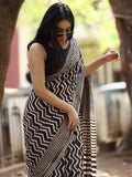 Maheswari fancy saree in black and white color with printed pallu and attached blouse