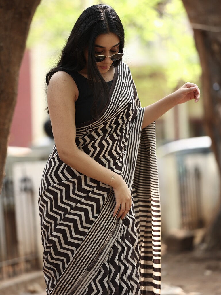 Maheswari fancy saree in black and white color with printed pallu and attached blouse