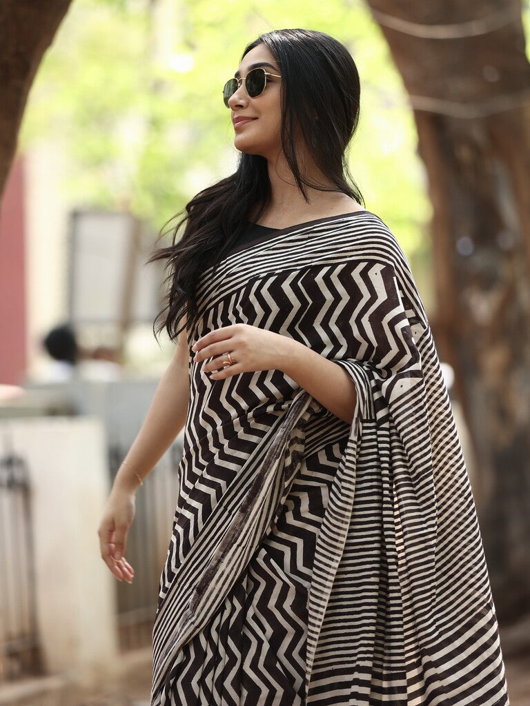 Maheswari fancy saree in black and white color with printed pallu and attached blouse
