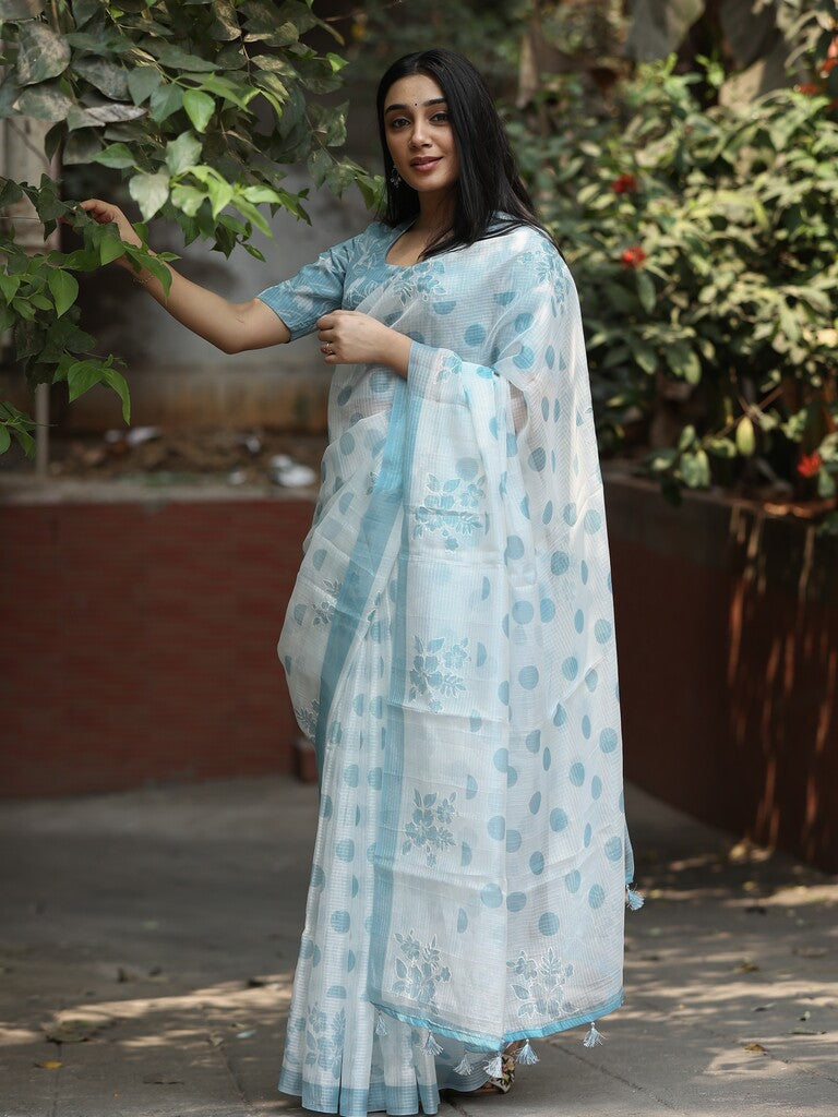 Kota fancy saree in white color allover motifs with running pallu and matching blouse