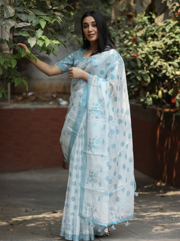 Kota fancy saree in white color allover motifs with running pallu and matching blouse