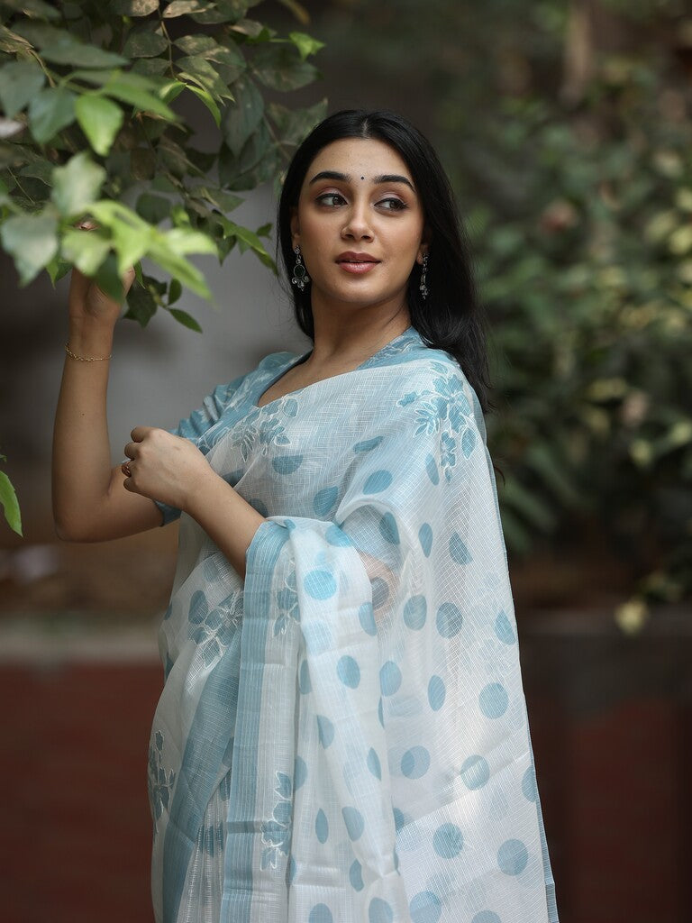 Kota fancy saree in white color allover motifs with running pallu and matching blouse