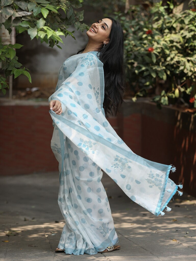 Kota fancy saree in white color allover motifs with running pallu and matching blouse