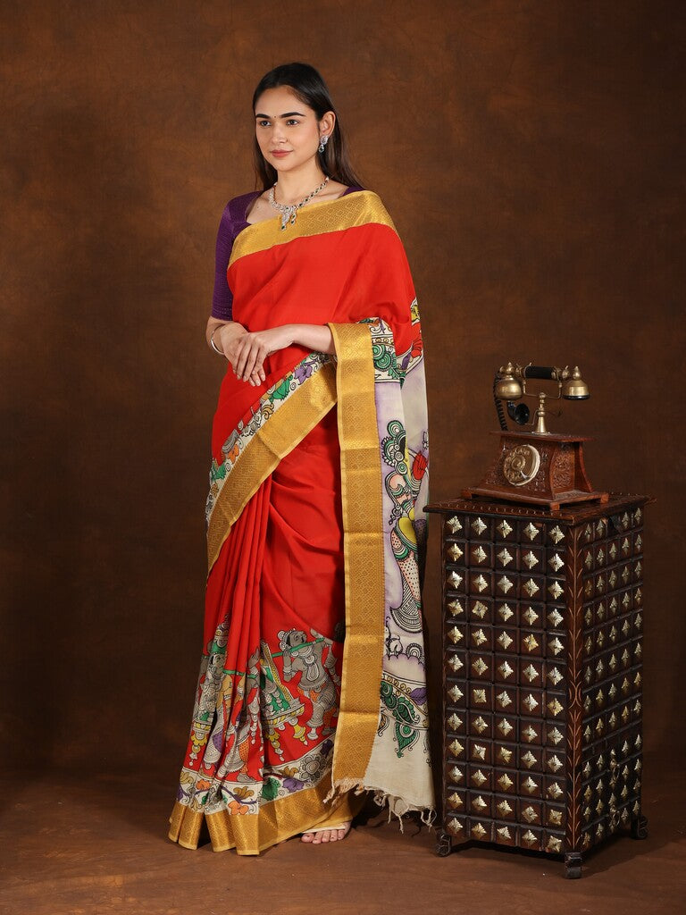 Pen kalamkari pattu saree in orange color with contrast zari border and printed pallu & attached blouse