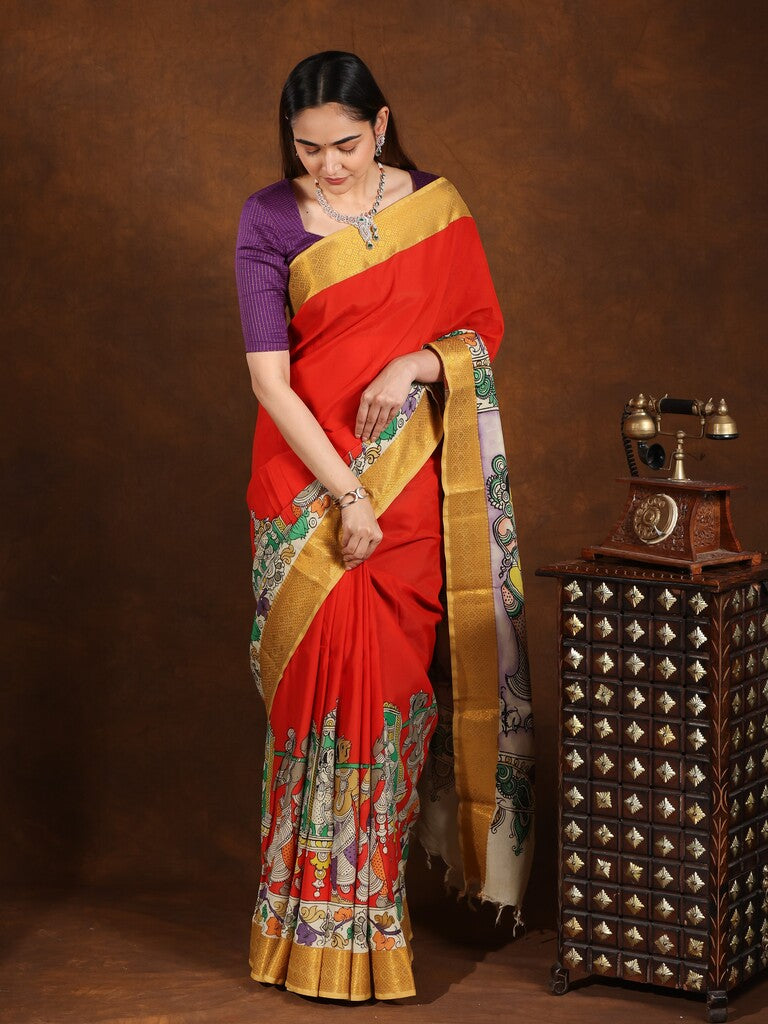Pen kalamkari pattu saree in orange color with contrast zari border and printed pallu & attached blouse