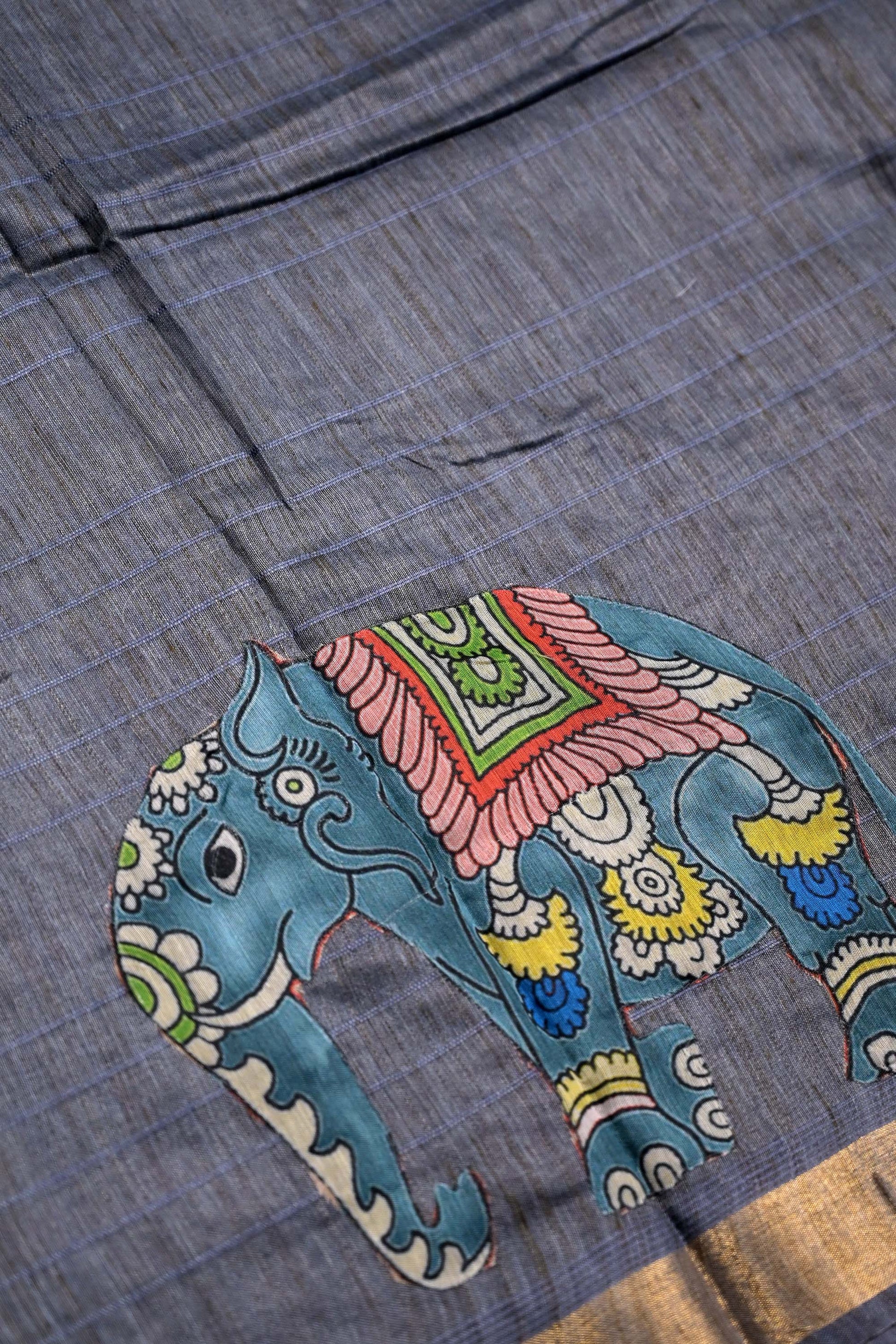 Tussar jute saree light grey color with kalamkari prints, big printed pallu, small kaddi border and printed blouse