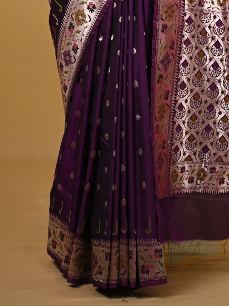 Banaras pattu fancy saree in violet color allover zari motifs and paithani border paired with plain blouse