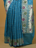 Banaras pattu fancy saree in sky blue color allover zari motifs and paithani border paired with plain blouse
